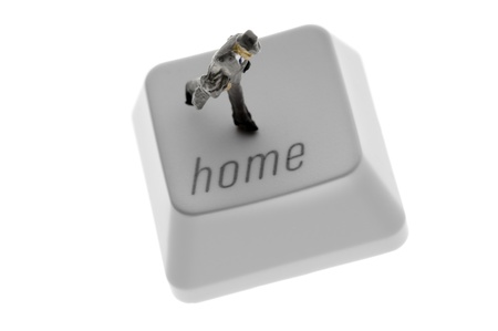 businessman figure on 'home' keyの写真素材