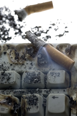 Cigarette butts on Keyboardの写真素材