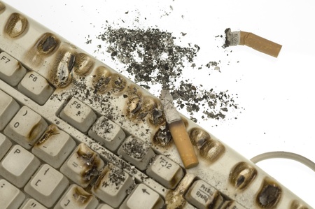 Cigarette butts on Keyboardの写真素材