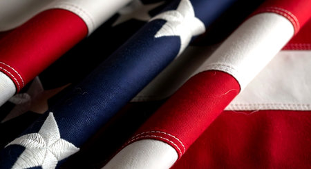 Close-up of the American flag on a textile background. Selective focus.の素材