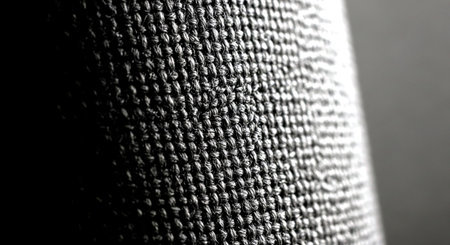 black and white macro photo of a knitted fabric with a patternの素材