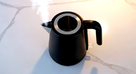 Black electric kettle on a white marble background. 3d render.の素材