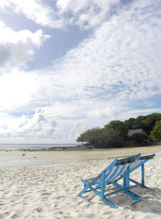 Two relaxing deck chair were provided for tourist who want to enjoy the beach                               の写真素材