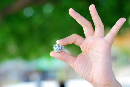 Sea shell was hold by girlの写真素材