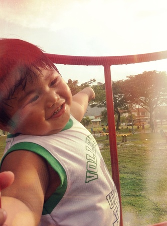 Cute baby at playgroundの素材