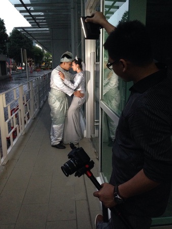 Videographer holding LED lightの素材