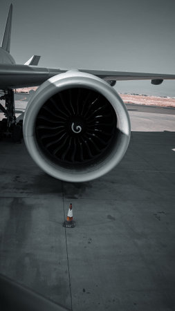 Airplane engine on the tarmac of the airport in the evening