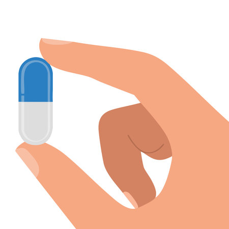Vector illustration in flat style of human hand holding pill capsule blue and white perfect for healthcare pharmacy medicine and treatment themed designsのイラスト素材
