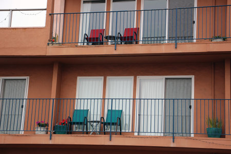 Hotel with balconies and chairs close up in foggy weather in Capitola Californiaの写真素材