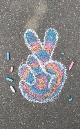 A lot of drawings on the asphalt with colorful crayon.の写真素材