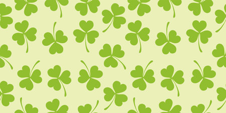 Seamless pattern of clover leaves. Vector illustration, light green background. Vector illustrationのイラスト素材
