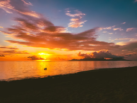 People watching bright orange sunset over sea, cloudy sky. Beautiful nature landscape. Impressive colorful seascape. Amazing natural background. Popular touristic destinationの写真素材