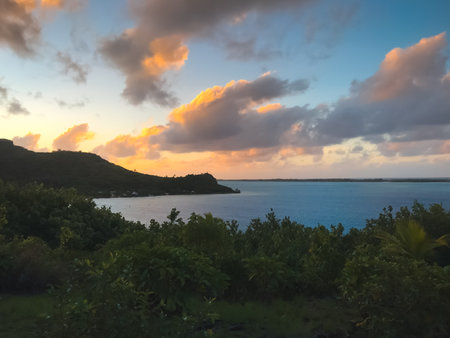 Tropical colorful sunset over sea lagoon island bay. Colorful cloudy sky. Scenic image of fairy-tale...