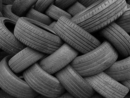 Pile of used car tires, close-up. black and whiteの写真素材