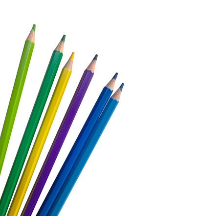 Colored pencils green, yellow, light green, purple, blue and cyan on a white background, space for insertion, space for textの写真素材