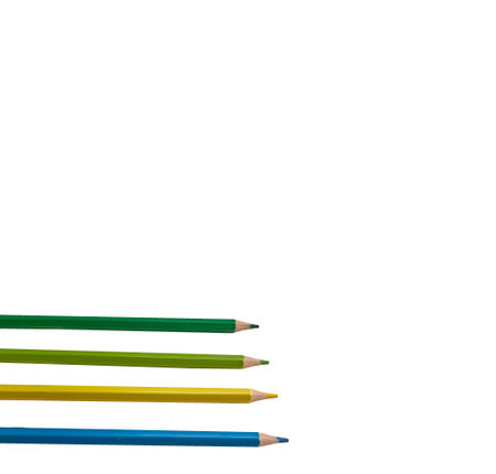 four colored pencils on a white background, green, blue, yellow and light greenの写真素材