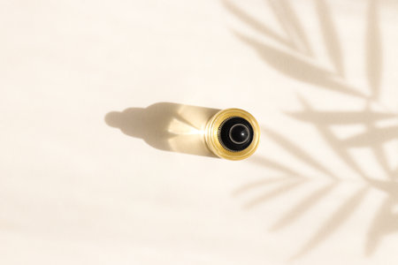 Bottle of cosmetic essential oil with dropper. Hard light. Beauty concept. Serum skin care product. Top view.の写真素材