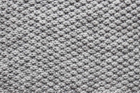 The texture of the woolen knitted gray sweater. Close-up.の写真素材