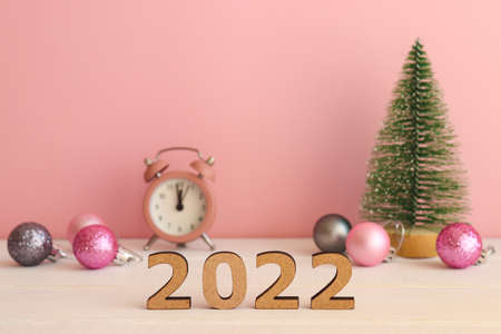 New Year or Christmas background with copy space. Christmas tree toy, Christmas balls, clock and...