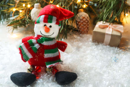 Christmas festive postcard with Christmas tree branches, snowflakes, Christmas toys and wooden...