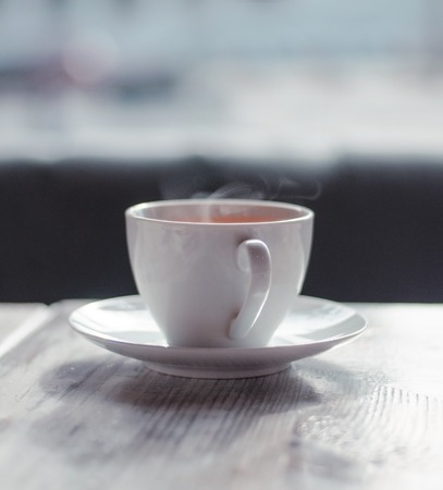 White Cup of hot tea on the table
