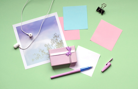 A small gift of pale lilac. Office, stickers on a green background.の写真素材