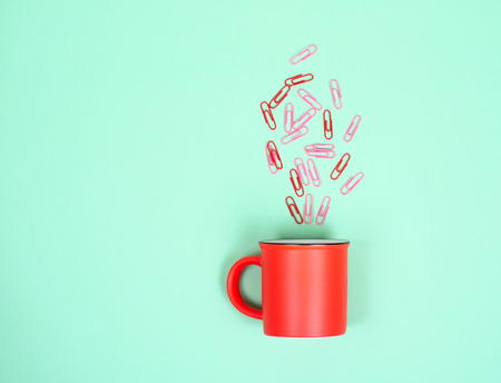 Conceptual photo of office Cup and paper clips.の写真素材