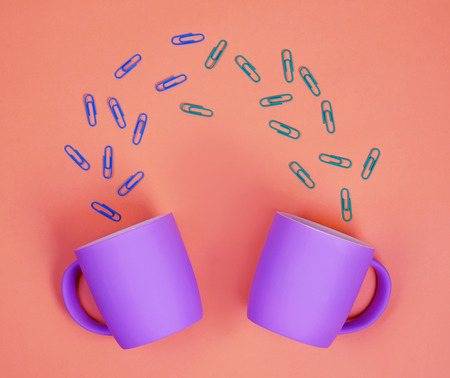 Conceptual photo of office Cup and paper clips.の写真素材