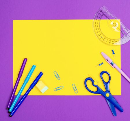 Still life with stationery on a purple background. Preparation for studies. Thematic photo about studying.の写真素材