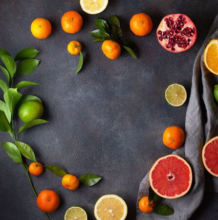 Fruit on a dark background. Citrus fruits, healthy food concept. Fresh fruit. The view from the top.の写真素材