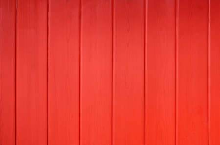 Red wooden background. Bright background. The wooden texture.