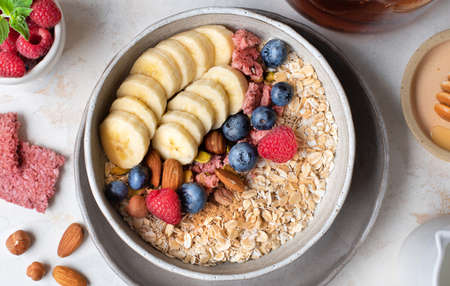 Healthy diet. Oatmeal. Ingredients for porridge. Wholesome breakfast. Delicious summer berries....