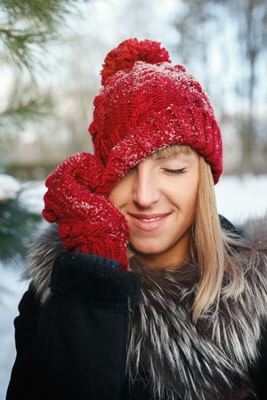 The girl pulls hat over eyesの写真素材