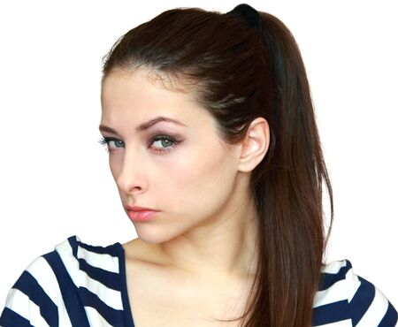 Closeup portrait of suspicious beautiful young woman isolated on white backgroundの写真素材