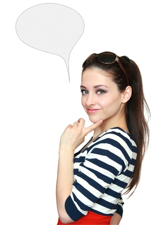 Beautiful teenage girl thinking with blank thought bubble isolated holding finger on the faceの写真素材