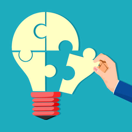 The human hand inserted the missing puzzle into the light bulb. full of creativity. vectorのイラスト素材