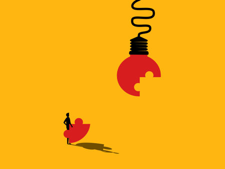 Connecting Ideas. man completes the light bulb jigsaw puzzle. vectorのイラスト素材