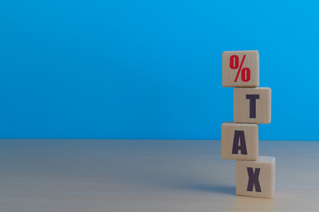 Finance and Investment Plans, Interest Rates, Percentage and Tax Icons on Wooden Cubesの写真素材