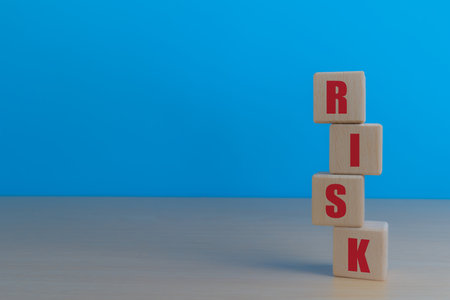 Spell the word risk on the wooden blockの写真素材