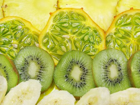 kiwano pineapple kiwi banana slices isolated isolatedの写真素材