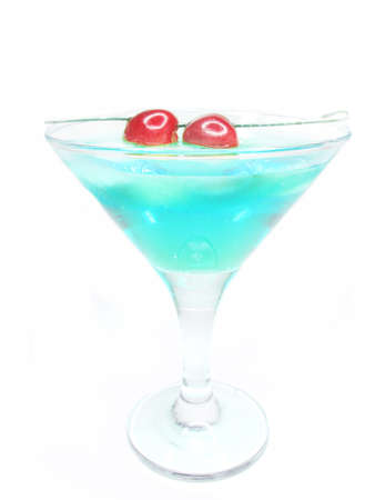 alcohol blue liqueur cocktail with ice and cherryの写真素材