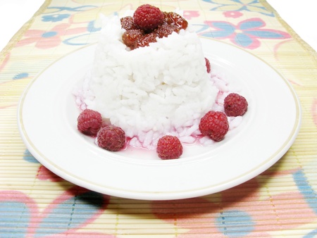 rice porridge with raspberry in syrupの写真素材