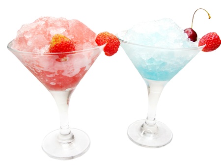 two alcoholic cocktail drinks with ice and cherryの写真素材