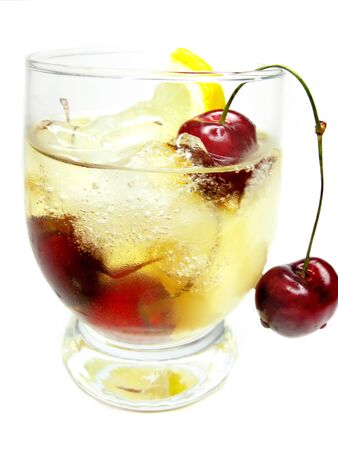 alcohol brandy cocktail with ice and cherryの写真素材