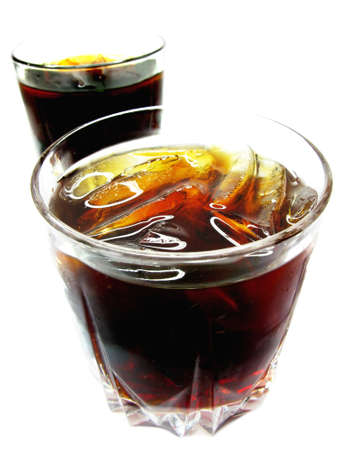 two glasses of cola lemonade drink with ice 