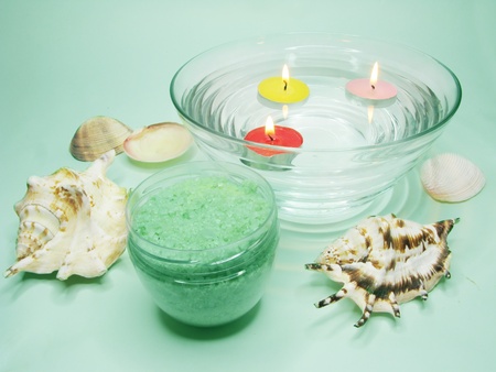 spa lit candles bathing salt sea shells and essencesの写真素材