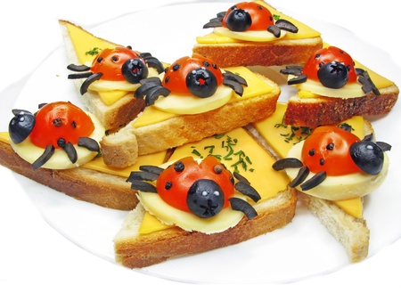 creative sandwich with cheese and lady bugs made of tomatoの写真素材