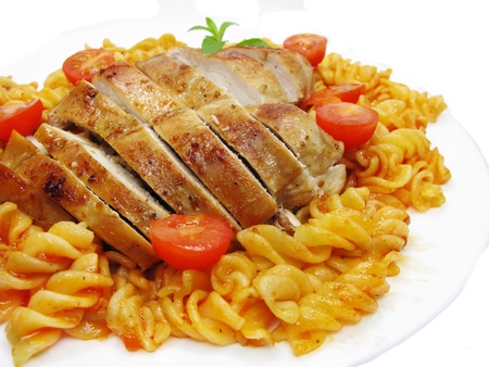 chicken roast meat with pasta and tomatoの写真素材