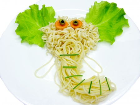 creative spaghetti food garnish with sausage elephant shapeの写真素材