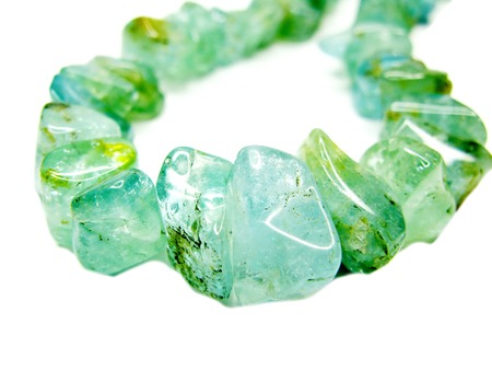tourmaline gemstone beads isolated on white backgroundの写真素材